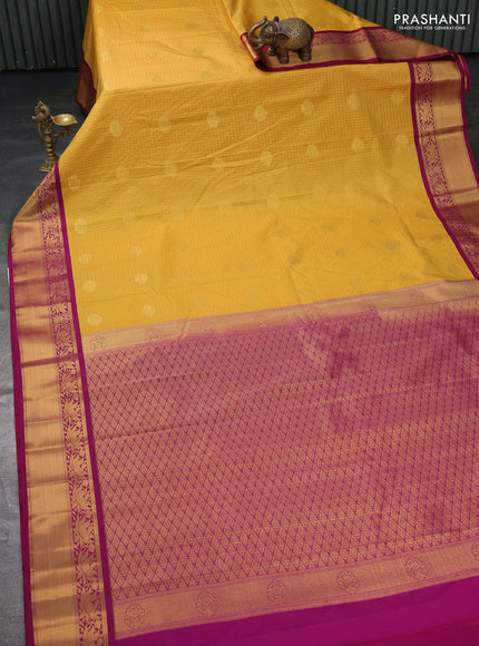 Semi kanchipuram silk saree mustard yellow and purple with allover zari checks & buttas and zari woven korvai border