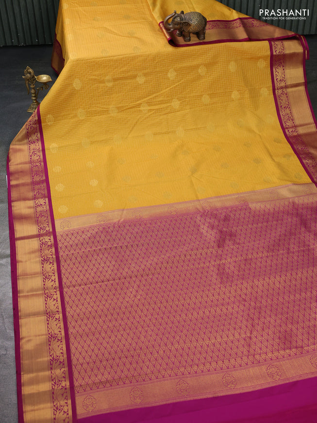 Semi kanchipuram silk saree mustard yellow and purple with allover zari checks & buttas and zari woven korvai border