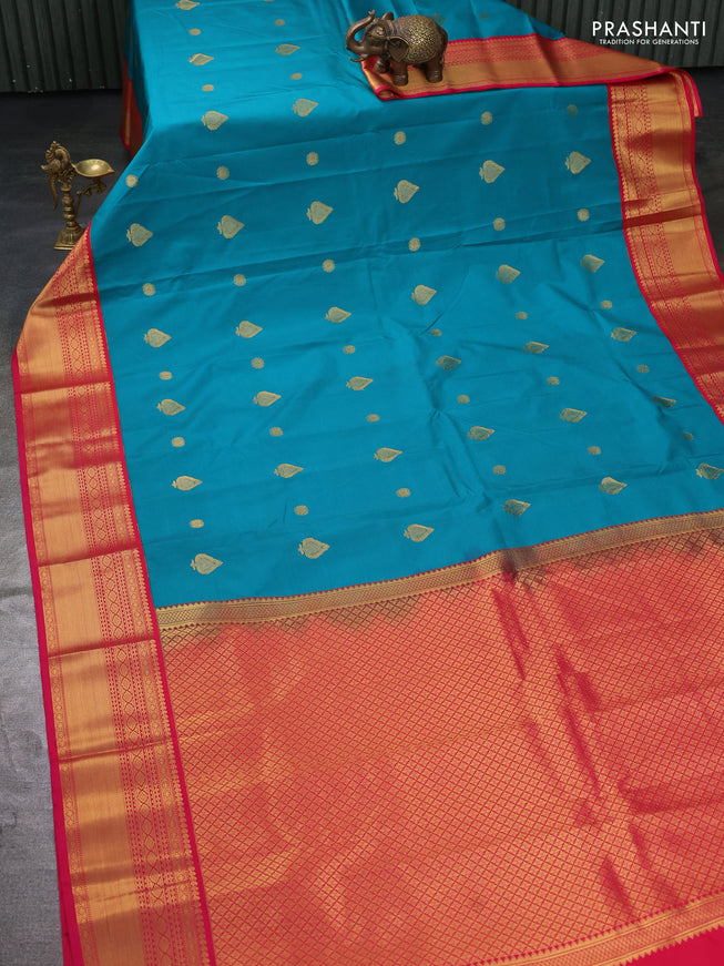 Semi kanchipuram silk saree teal green and pink with zari woven buttas and zari woven korvai border