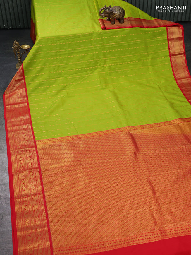 Semi kanchipuram silk saree light green and red with allover zari weaves and zari woven korvai border