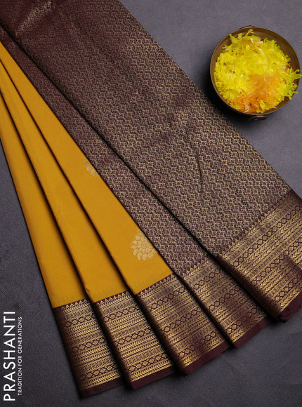 Semi kanchipuram silk saree yellow and coffee brown with zari woven buttas and zari woven korvai border
