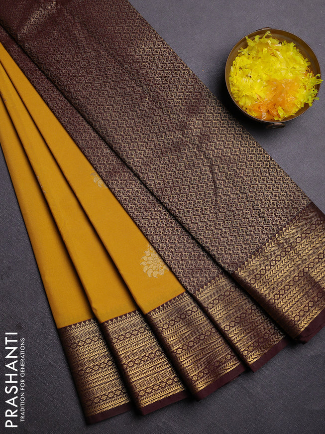 Semi kanchipuram silk saree yellow and coffee brown with zari woven buttas and zari woven korvai border