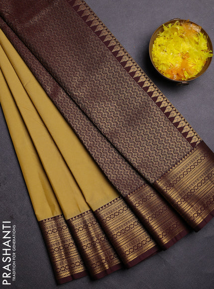 Semi kanchipuram silk saree yellow and brown with zari woven buttas and zari woven korvai border