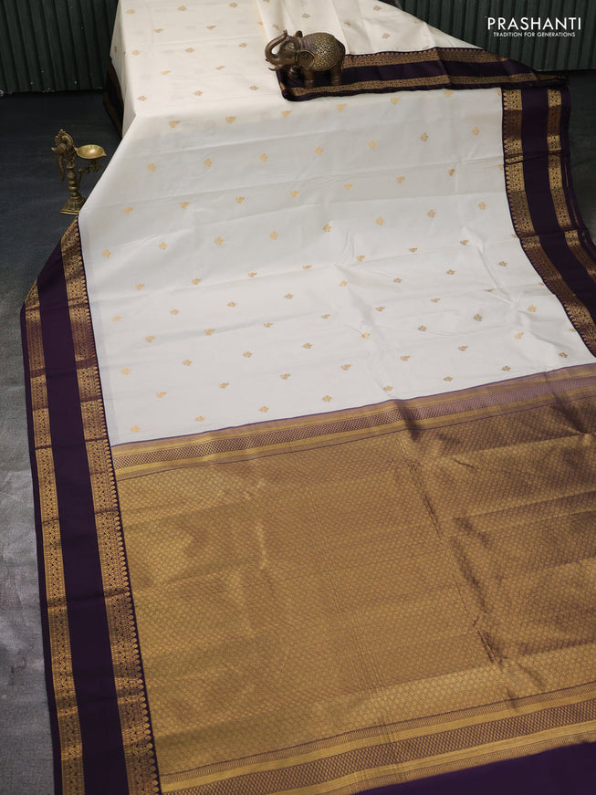 Semi kanchipuram silk saree off white and deep jamun with zari woven buttas and rettapet zari woven border