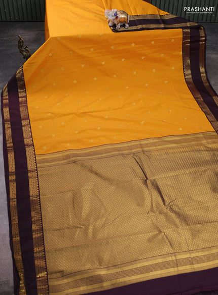Semi kanchipuram silk saree mango yellow and deep jamun with zari woven buttas and rettapet zari woven border