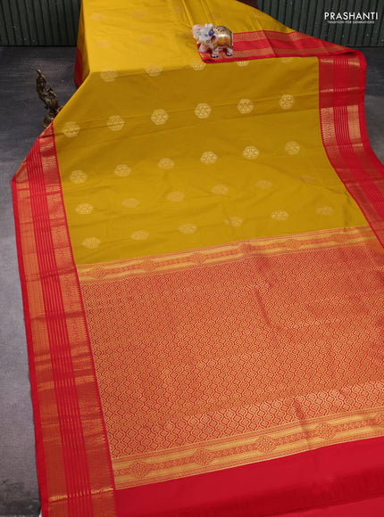 Semi kanchipuram silk saree yellow and red with zari woven buttas and zari woven koravi border