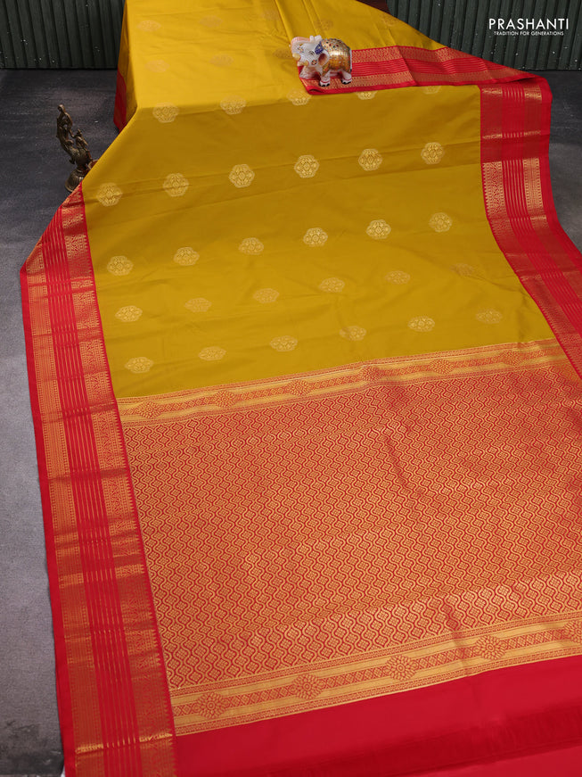 Semi kanchipuram silk saree yellow and red with zari woven buttas and zari woven koravi border