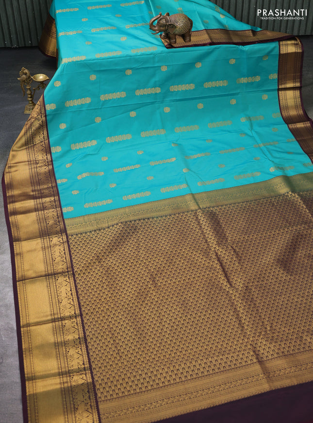 Semi kanchipuram silk saree teal green and brown with zari woven buttas and zari woven koravi border