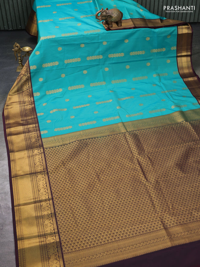 Semi kanchipuram silk saree teal green and brown with zari woven buttas and zari woven koravi border