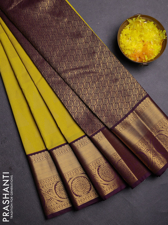 Semi kanchipuram silk saree lime yellow and deep wine with allover zari weaves and zari woven korvai border
