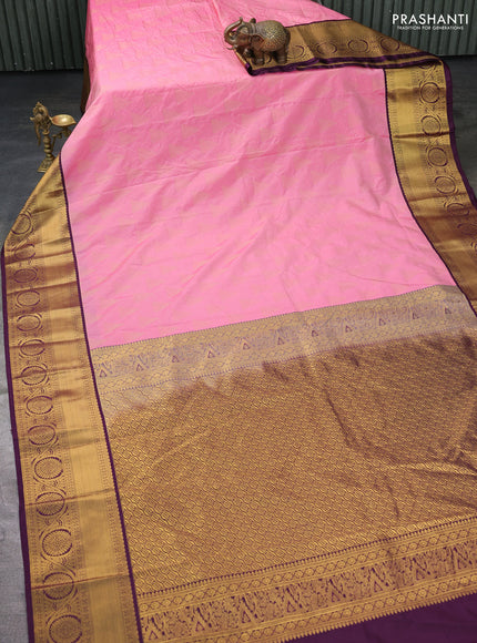 Semi kanchipuram silk saree light pink and deep wine with allover zari weaves and zari woven korvai border