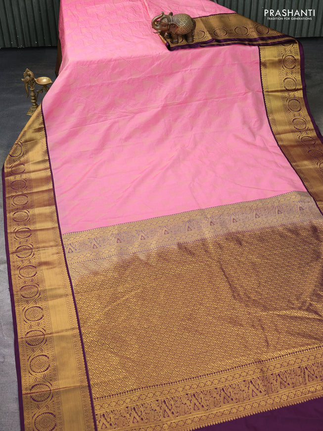 Semi kanchipuram silk saree light pink and deep wine with allover zari weaves and zari woven korvai border