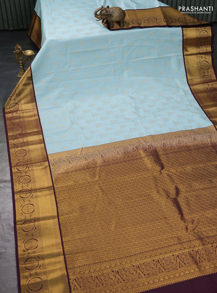 Semi kanchipuram silk saree pastel blue and deep wine with allover zari weaves and zari woven korvai border