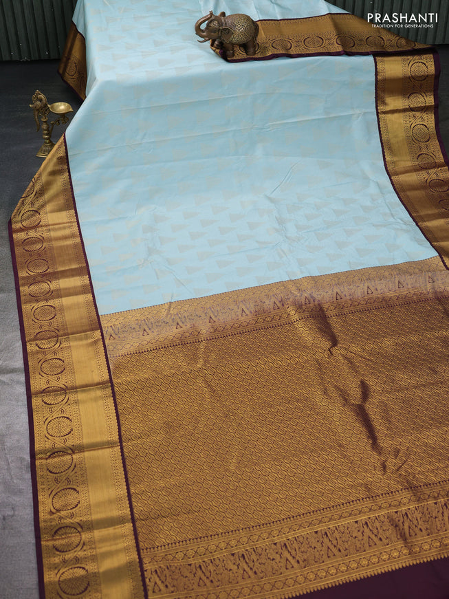 Semi kanchipuram silk saree pastel blue and deep wine with allover zari weaves and zari woven korvai border