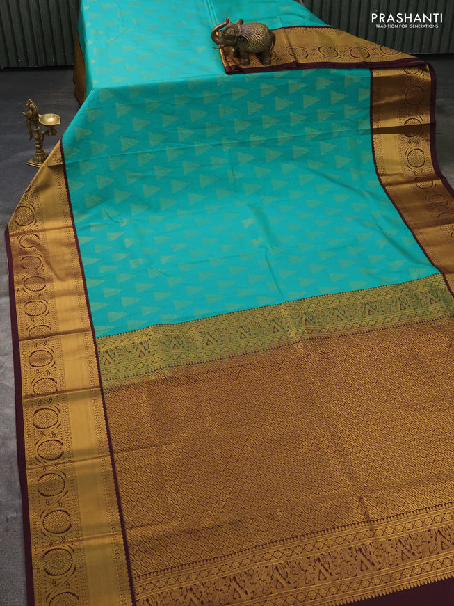 Semi kanchipuram silk saree teal green and deep wine with allover zari weaves and zari woven korvai border