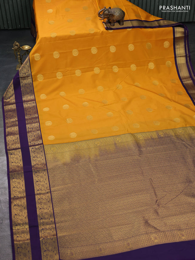 Semi kanchipuram silk saree mustard yellow and deep violet with zari woven buttas and rettapet zari woven border