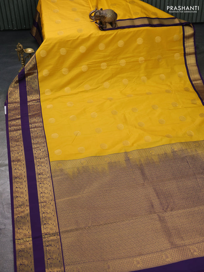 Semi kanchipuram silk saree yellow and deep violet with zari woven buttas and rettapet zari woven border