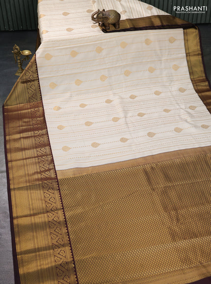 Semi kanchipuram silk saree off white and coffee brown with allover zari weaves and long zari woven border