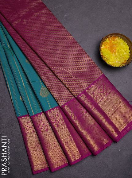 Semi kanchipuram silk saree teal green and purple with allover zari weaves and long zari woven border