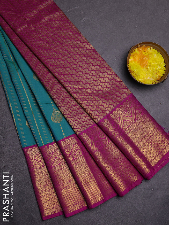 Semi kanchipuram silk saree teal green and purple with allover zari weaves and long zari woven border