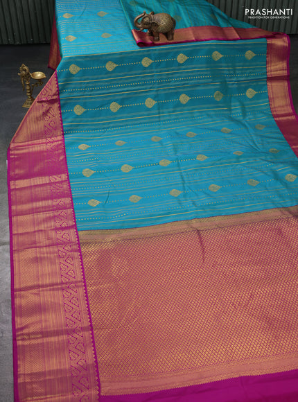 Semi kanchipuram silk saree teal green and purple with allover zari weaves and long zari woven border