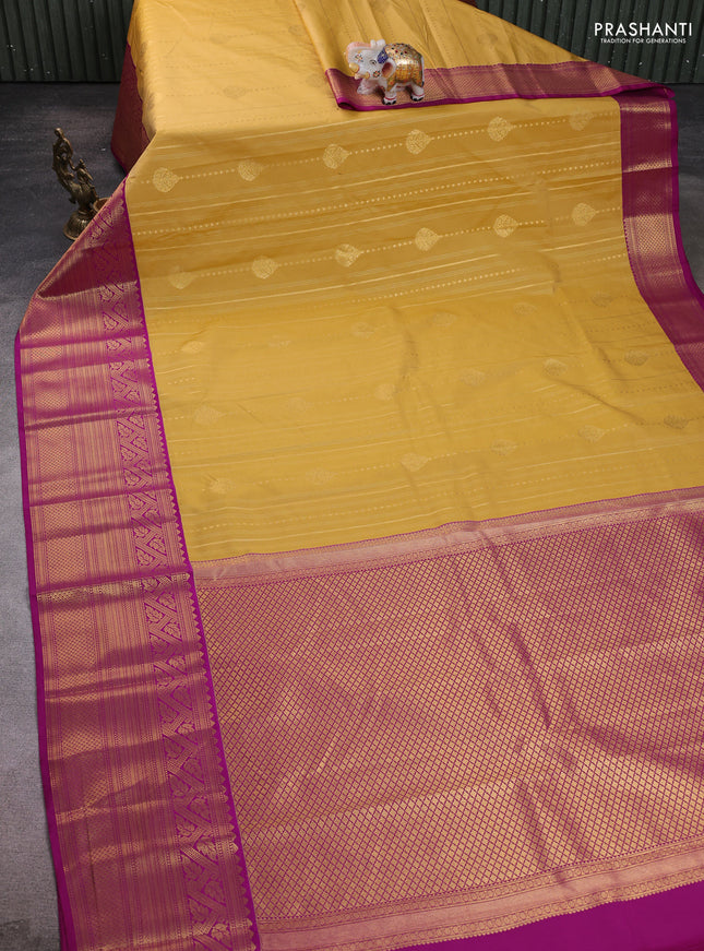 Semi kanchipuram silk saree yellow and purple with allover zari weaves and long zari woven border
