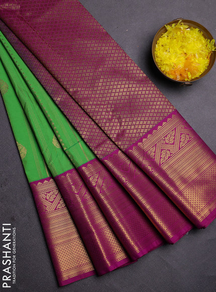 Semi kanchipuram silk saree light green and purple with allover zari weaves and long zari woven border
