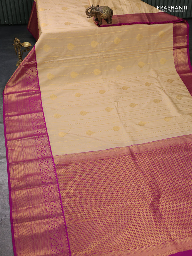Semi kanchipuram silk saree sandal and magenta pink with allover zari weaves and long zari woven border