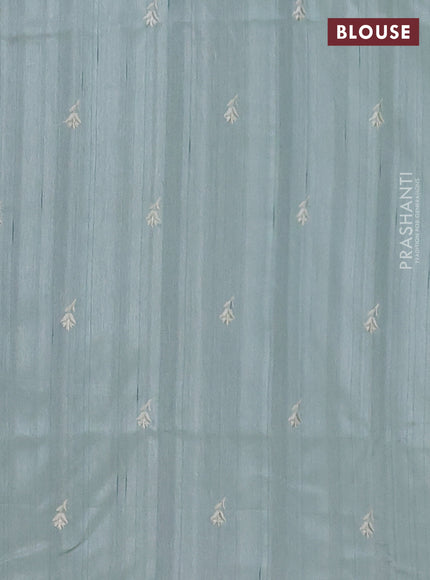 Semi raw silk saree pastel green with embroidered buttas and embroidery border