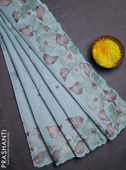 Semi raw silk saree pastel blue with embroidered buttas and embroidery border