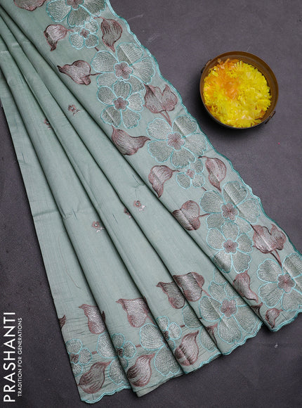 Semi raw silk saree pastel green with embroidered buttas and embroidery border
