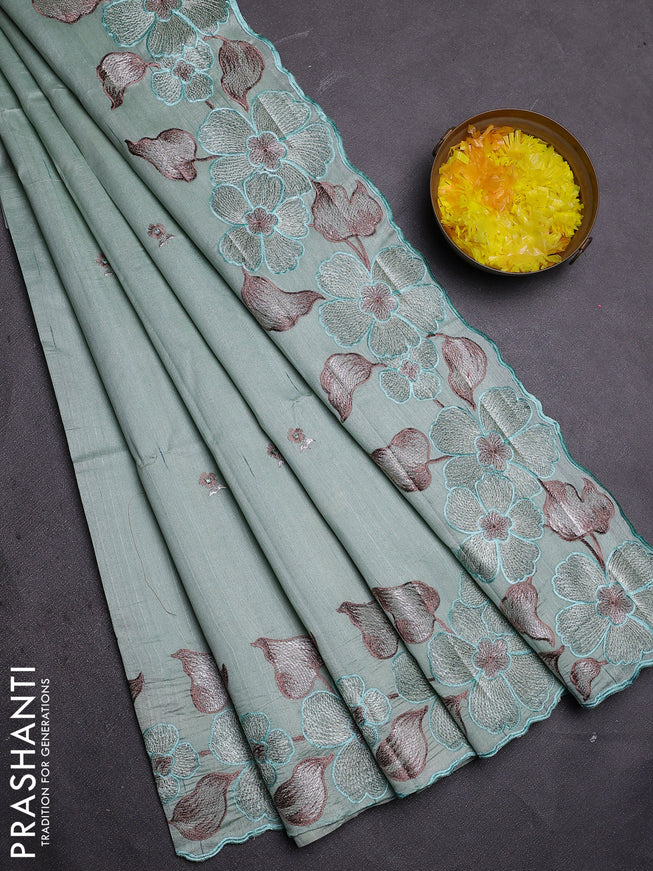 Semi raw silk saree pastel green with embroidered buttas and embroidery border