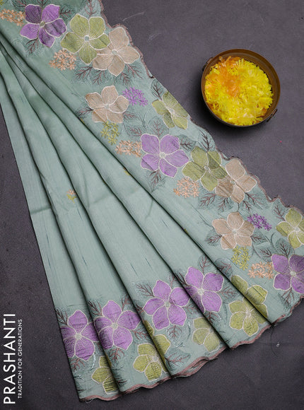 Semi raw silk saree pastel green with embroidered buttas and embroidery border