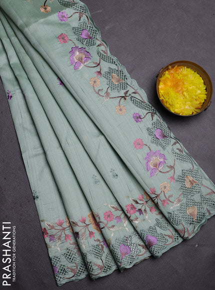 Semi raw silk saree pastel green with embroidered buttas and embroidery cut work border