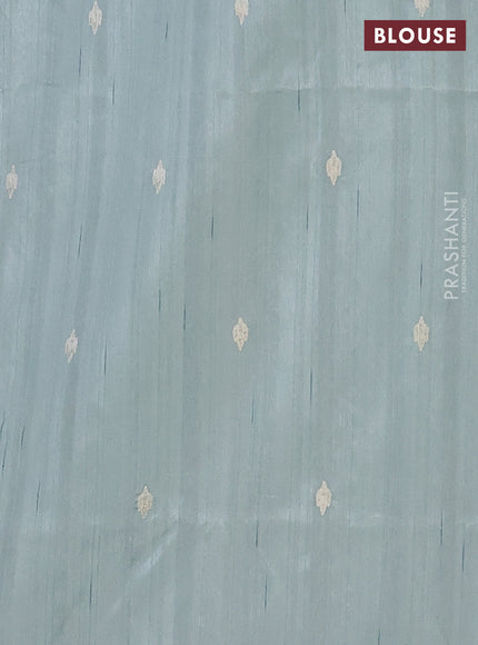 Semi raw silk saree pastel green with embroidered buttas and embroidery cut work border