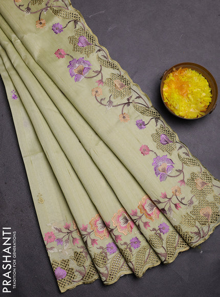 Semi raw silk saree pista green with embroidered buttas and embroidery cut work border