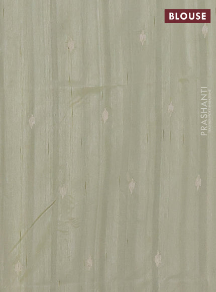 Semi raw silk saree pista green with embroidered buttas and embroidery cut work border