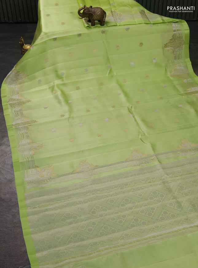 Banarasi poona silk saree pista green with silver & gold zari woven buttas and rich zari woven border