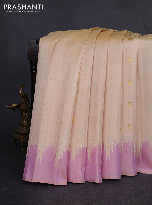 Pure gadwal silk saree cream and lotus pink with zari woven buttas and temple design boder