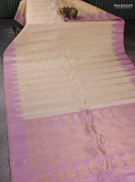 Pure gadwal silk saree cream and lotus pink with zari woven buttas and temple design boder