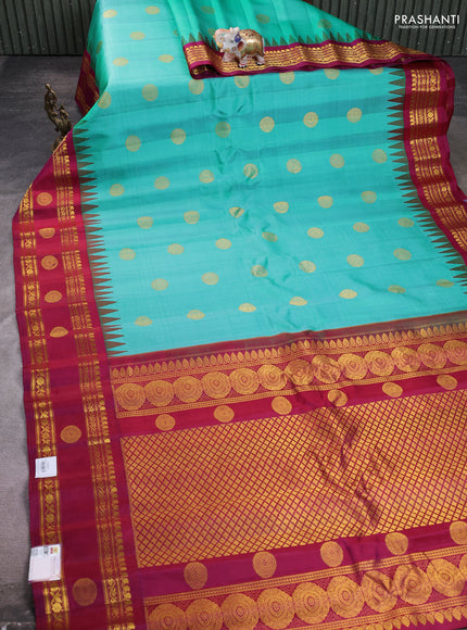 Pure gadwal silk saree teal green and dark magenta pink with zari woven buttas and temple design zari woven butta border
