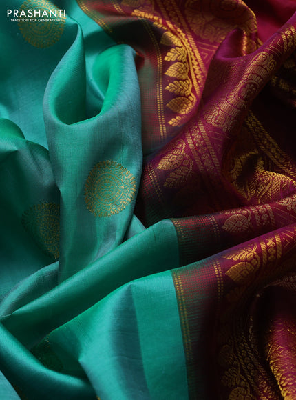 Pure gadwal silk saree teal green and dark magenta pink with zari woven buttas and temple design zari woven butta border