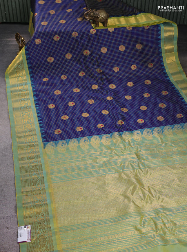 Pure gadwal silk saree navy blue and dual tone light green with allover zari checks & buttas and temple design zari woven border