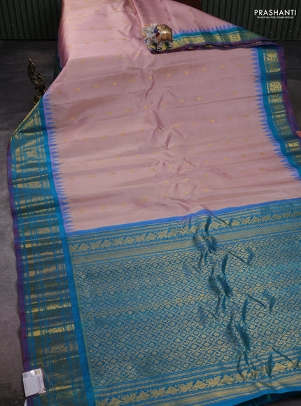 Pure gadwal silk saree pastel peach and dual tone teal green with zari woven buttas and temple design zari woven border