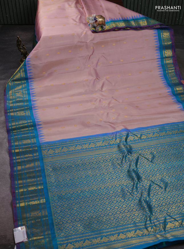 Pure gadwal silk saree pastel peach and dual tone teal green with zari woven buttas and temple design zari woven border