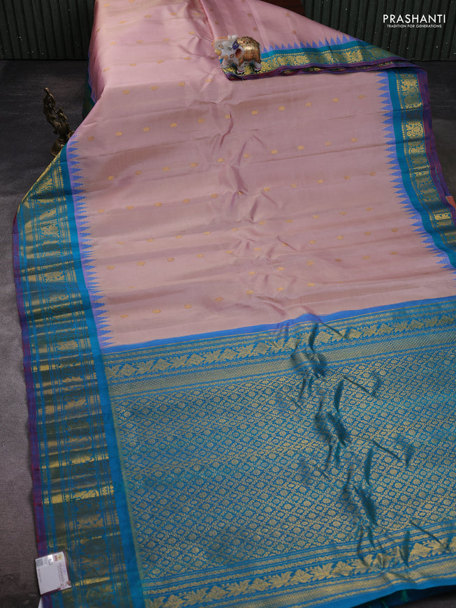 Pure gadwal silk saree pastel peach and dual tone teal green with zari woven buttas and temple design zari woven border