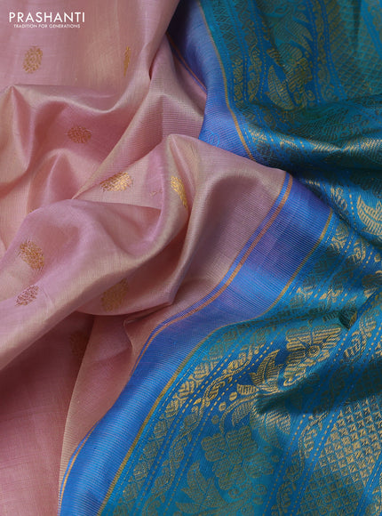 Pure gadwal silk saree pastel peach and dual tone teal green with zari woven buttas and temple design zari woven border