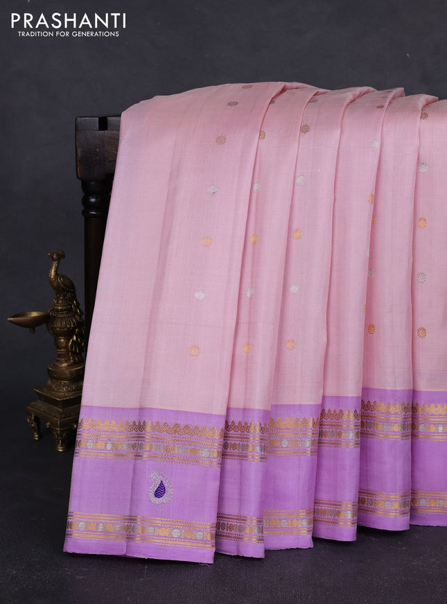 Pure gadwal silk saree mild peach and mild lavender with allover silver & gold zari woven buttas and rettapet zari woven paisley butta border