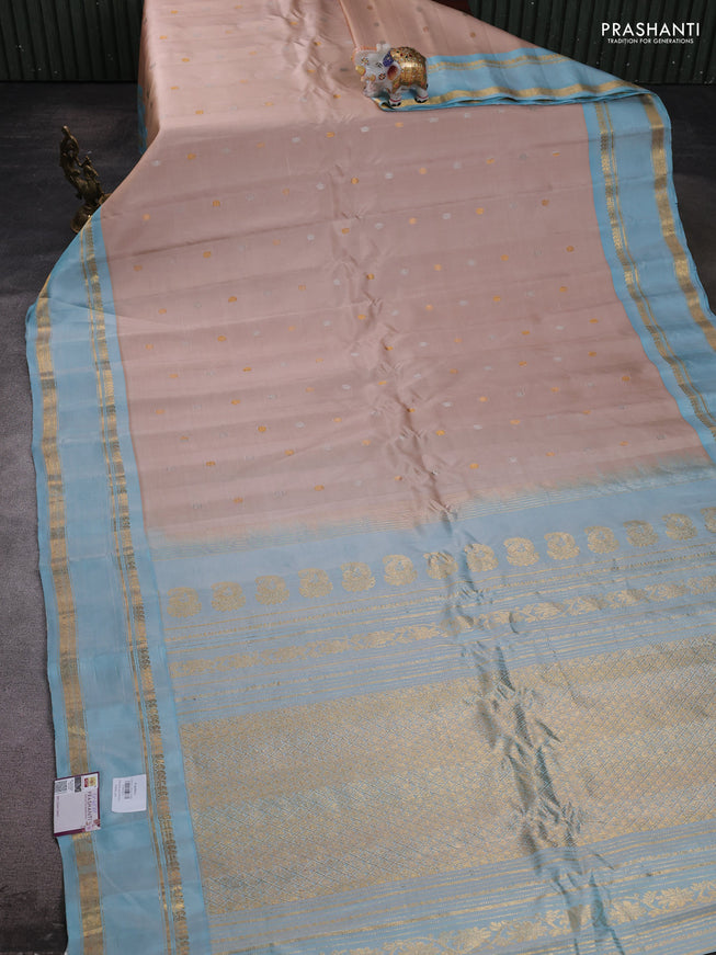 Pure gadwal silk saree sandal and light blue with silver & gold zari woven buttas and rettapet zari woven border