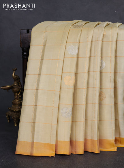 Pure gadwal silk saree cream and mustard yellow with allover zari checks & buttas and simple boder